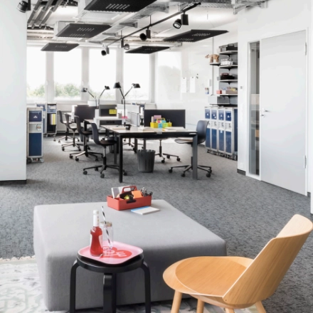 Modern office space in Berlin Friedrichshain with workstations and windows, perfect for office space rental.