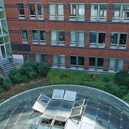Exterior view of Koppenstraße 93 in Berlin Friedrichshain, showcasing a modern office building available for rent.