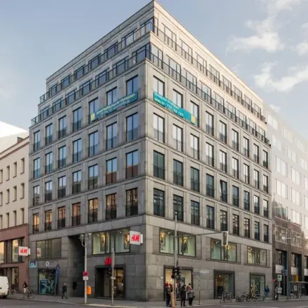 Exterior view of an office building on Friedrichstraße 79, ideal for office space rental in Berlin Mitte.