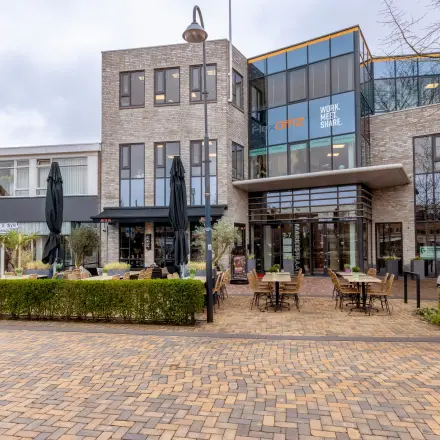 Exterior view of office building at Marktstraat 1-7, Bodegraven, showcasing potential office space rental opportunities.