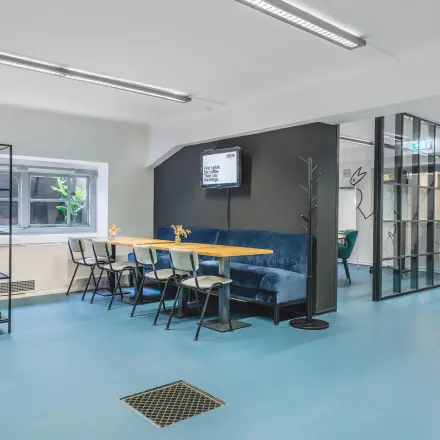 Interior view of a furnished office space rental at Ceresstraat 13, Breda Centrum-Station featuring modern seating and a meeting area.