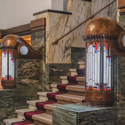 Interior view of an office at Ceresstraat 13, featuring a stylish stairway with decorative lighting, ideal for office space rental.