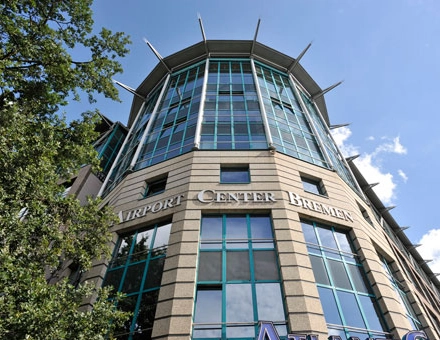 Exterior view of a modern office building at Flughafenallee 26, Bremen Neustadt, ideal for office space rental.
