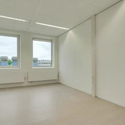 Unfurnished office space with large windows at Regulierenring 2, Bunnik, ideal for rent office space.