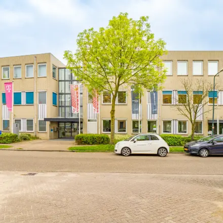 Exterior view of an office building at Regulierenring 2, Bunnik, showcasing office space rental availability.