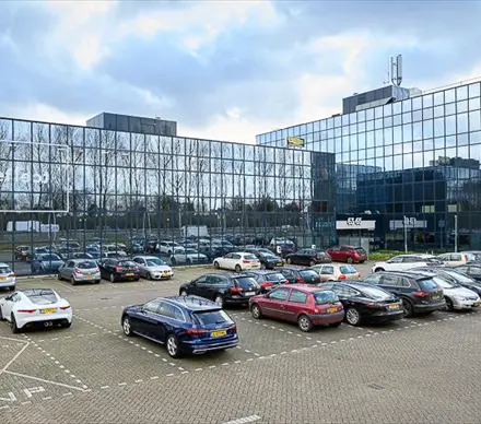 Exterior view of the modern office building at Essebaan 63, Capelle aan den IJssel, showcasing the parking area. Ideal for businesses looking for office space rental.