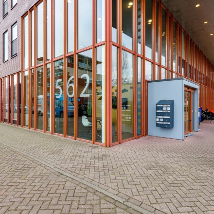 Exterior view of office building at Fascinatio Boulevard 562 in Capelle aan den IJssel, showcasing large glass windows and a visible entrance.