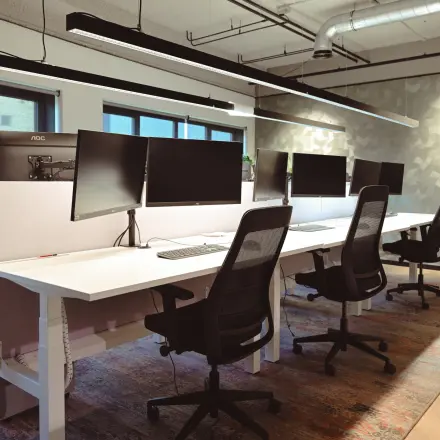 Modern office space at Rivium Quadrant 75, Capelle aan den IJssel, featuring multiple workstations with computers and ergonomic chairs ideal for office space rental.