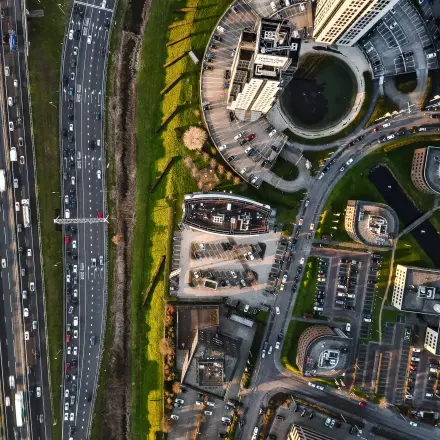 Aerial view of Rivium Quadrant 75 in Capelle aan den IJssel, showcasing office buildings and parking areas.