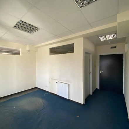 Unfurnished office space available for rent at Marcika 27, Cracow Łagiewniki Borek Fałęcki, featuring modern lighting and potential for customization in a well-lit environment.