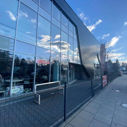 Exterior view of a modern office building at Marcika 27, Cracow Łagiewniki Borek Fałęcki, showcasing glass facades suitable for office space rental.