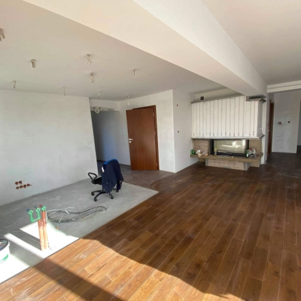 Unfurnished office interior at Jastrzębia 24 in Cracow Podgorze Duchackie, featuring wooden floors and a large open space, ideal for office space rental opportunities.