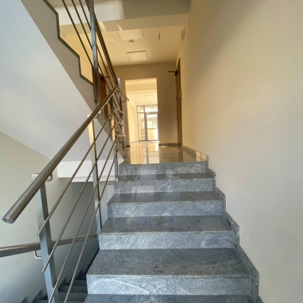 Staircase leading to office space rental at Jastrzębia 24, Cracow Podgorze Duchackie, highlighting clean interiors.