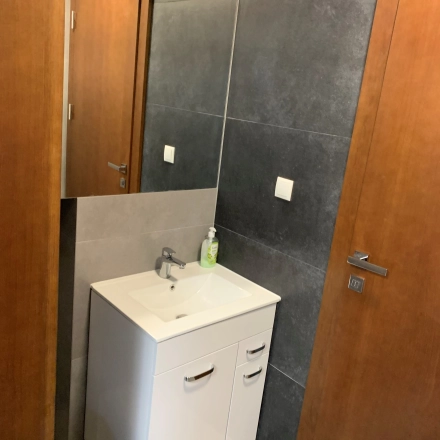 Modern and functional restroom in an office space rental at Jastrzębia 24, Cracow Podgorze Duchackie, featuring a sleek sink and contemporary design.