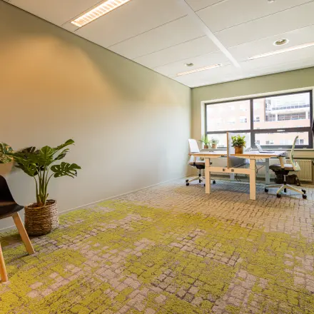 Bright office at Rijnzathe 12, De Meern, featuring modern furnishings with desks and chairs, perfect for office space rental.