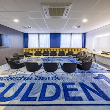 Office to rent at Amerikastraat 3, Den Bosch features a furnished conference room with a circular arrangement of chairs and tables for meetings. Ideal for office space rental.