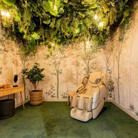 Stylish office space rental featuring a comfortable lounge chair with a nature-themed interior at Diemerhof 42, Diemen.