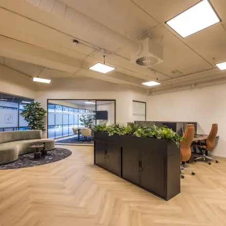 Spacious and modern office interior at Luchthavenweg 81, featuring stylish furniture and ample natural light, ideal for office space rental.