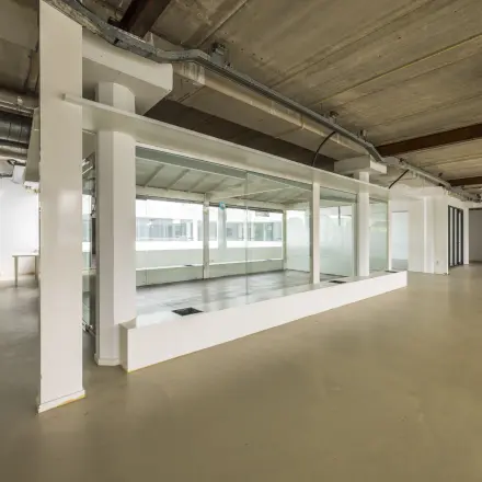 Spacious office to rent at Luchthavenweg 81, Eindhoven Airport, featuring open layout and large windows, ideal for office space rental.