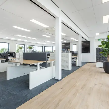Bright and open office space with desks and chairs, ready for office space rental at Meerenakkerplein in Eindhoven.