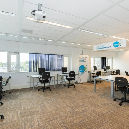 Bright and spacious office interior at Brandweerstraat 20-30, Enschede, featuring modern workstations with ample natural light, ergonomic chairs, and a clean layout ideal for productive work. Perfect office space rental opportunity.