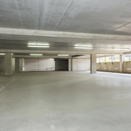 Spacious, well-lit parking area at Brandweerstraat 20-30 in Enschede, suitable for tenants seeking convenient office space rental with ample parking facilities on-site.