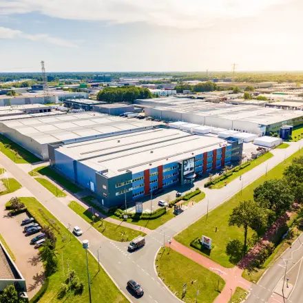 Aerial view of Marssteden 20 in Enschede, showcasing expansive office and industrial spaces available for rent.
