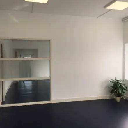 Spacious office interior for rent at Nijverheidsweg 50, Haarlem Oost, featuring natural light and a modern layout. Ideal for office space rental opportunities.
