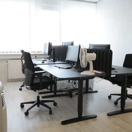 Bright, furnished office space at Waarderweg 19, Haarlem Waarderpolder, featuring desks, chairs, and computers with ample natural light. Ideal for office space rental.