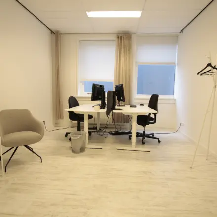 Bright office space at Waarderweg 19, Haarlem Waarderpolder, featuring two workstations with computers, ideal for office space rental.