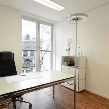 Bright office space at Colonnaden 5, Hamburg Neustadt with a desk, chair, and cabinet, ideal for office space rental.