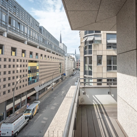 Street view of office buildings in Hamburg Old Town at Raboisen 38. Ideal location for those seeking office space rental with convenient access.