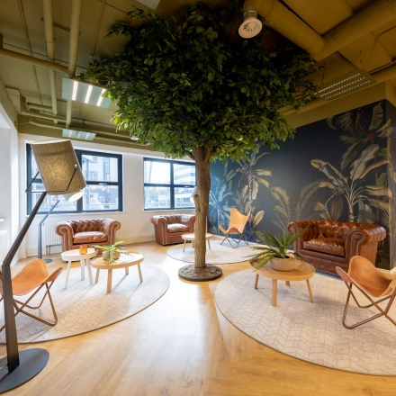 Welcoming office lounge at Olympia 1, Hilversum, featuring stylish chairs and plush decor for a comfortable office space rental experience.