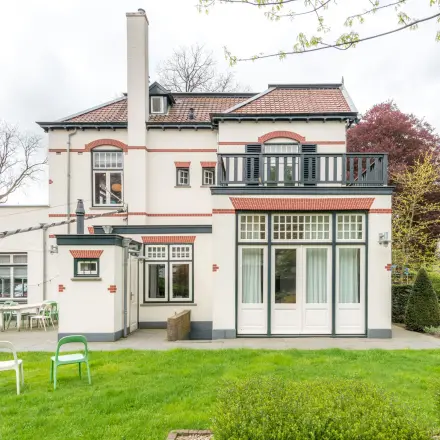 Charming exterior view of a traditional-style office building for rent in Hilversum, suitable for office space rental.