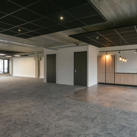 Spacious office interior at Zuiderloswal 55, Hilversum, perfect for office space rental with a modern open-floor design.