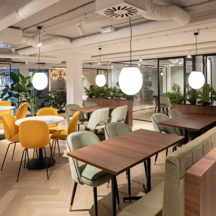 Modern office space with stylish seating and plants at Siriusdreef 60, ideal for collaborative work and inviting for office space rental.