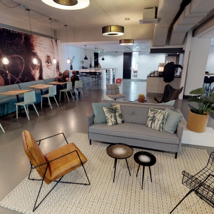Stylish office space at Meidoornkade 22, Houten, featuring modern furnishings and multiple work areas. Ideal for those seeking office space rental with creative, open-floor layouts.