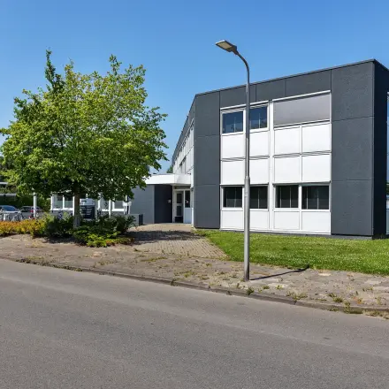 Exterior view of an office building at Ouddeelstraat 7a, Leeuwarden, ideal for office space rental.