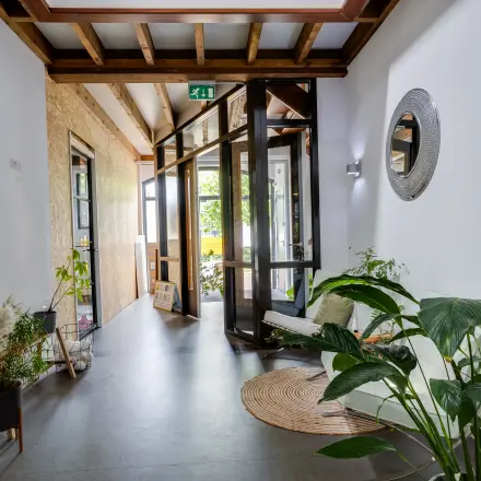 Bright office interior at Hamersveldseweg 120, Leusden, featuring modern decor with plants and stylish furnishings, perfect for office space rental opportunities.