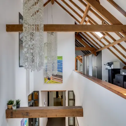 Interior view of Hamersveldseweg 120, Leusden, showcasing an office space rental with modern decor and wooden beams.