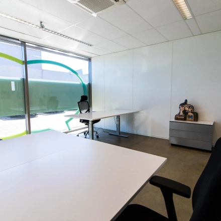 Bright office space available for rent at Brieltjenspolder 28, Made, featuring modern desks and ergonomic chairs in a well-lit environment.