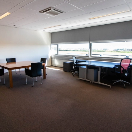 Bright office space for rent at Brieltjenspolder 28, Made, featuring desks and chairs, ideal for an office space rental.