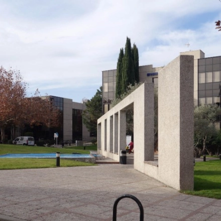 Modern office buildings at Calle de la Azalea 1 in Madrid Alcobendas, featuring sleek glass facades and landscaped greenery, ideal for office space rental.