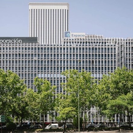 Exterior of a modern office building located at Paseo de la Castellana 93, Madrid Azca, suitable for office space rental.