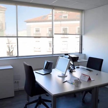 Well-lit office space with large windows offering city views at Plaza Santa María Soledad Torres Acosta 1, Madrid Center. Perfect for those seeking office space rental.