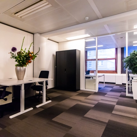 Office space at Paseo de Recoletos 5 in Madrid Recoletos features a modern furnished interior with desks and chairs, ideal for office space rental.