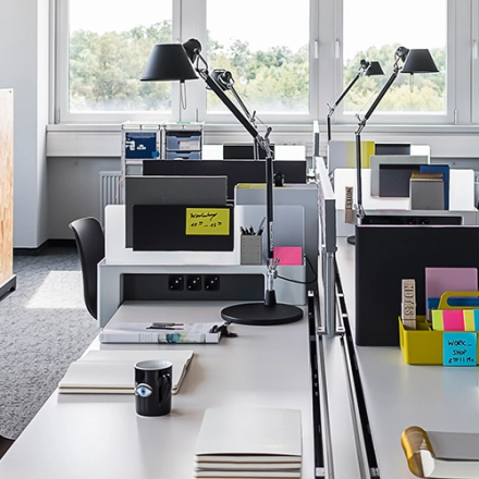 Modern office space at Rosenheimer Straße 143C, München Werksviertel, featuring sleek workstations, ample natural light, and practical furnishings, ideal for office space rental.