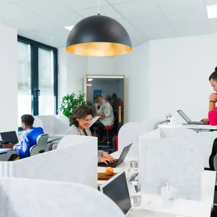Professionals engaged in work at a contemporary office space available for rent at Landsberger Straße 155, Munich Laim.