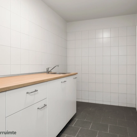 Clean and bright pantry area with white cabinets and a countertop, located at Nijverheidsweg 9B, Nieuwegein. Ideal for those considering office space rental.