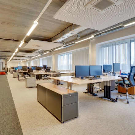 Office space at Zoomstede 19, Nieuwegein, featuring an open floor plan with modern furniture, large windows, and multiple workstations ideal for collaborative work. Perfect for office space rental.
